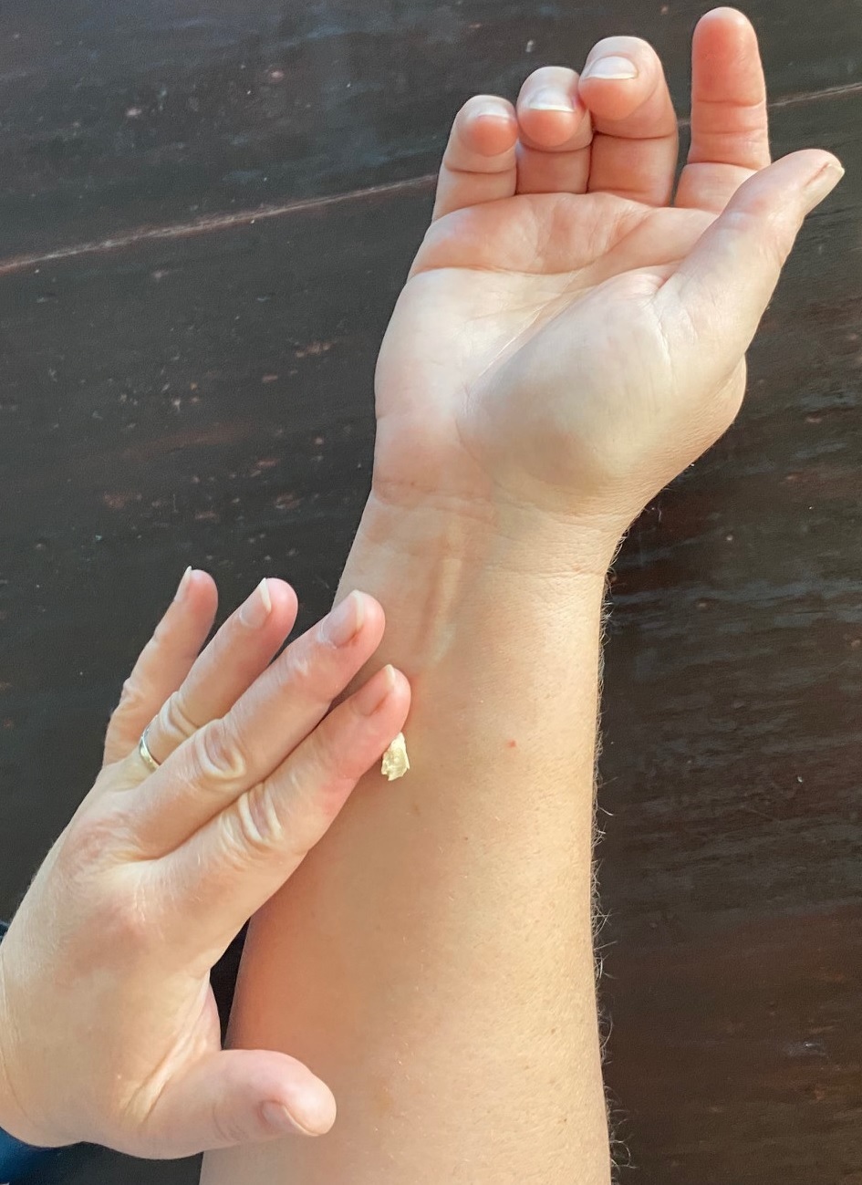 A breakdown of the cream's primary ingredients, with wild yam root, and chamomile flowers shown